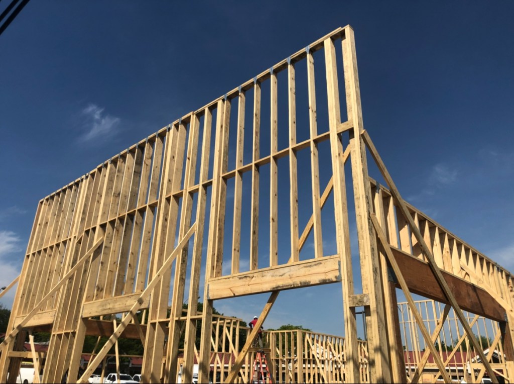 A wood-framed building under construction.